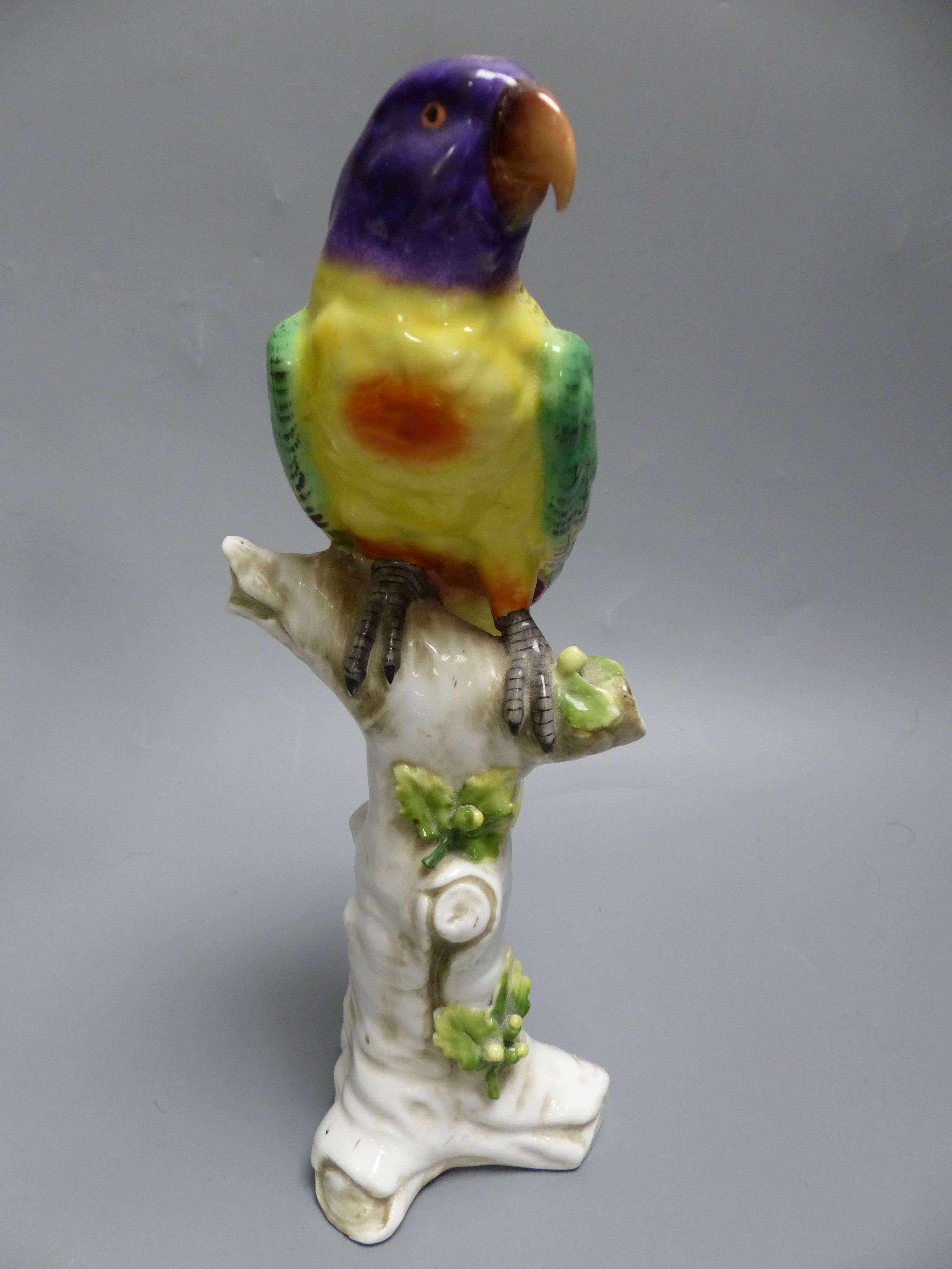 Two Continental porcelain models of parakeets, height 23.5cm